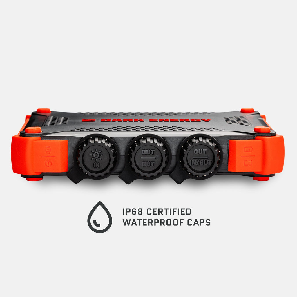 Orange and black XL power bank front view with three round output ports and waterproof caps