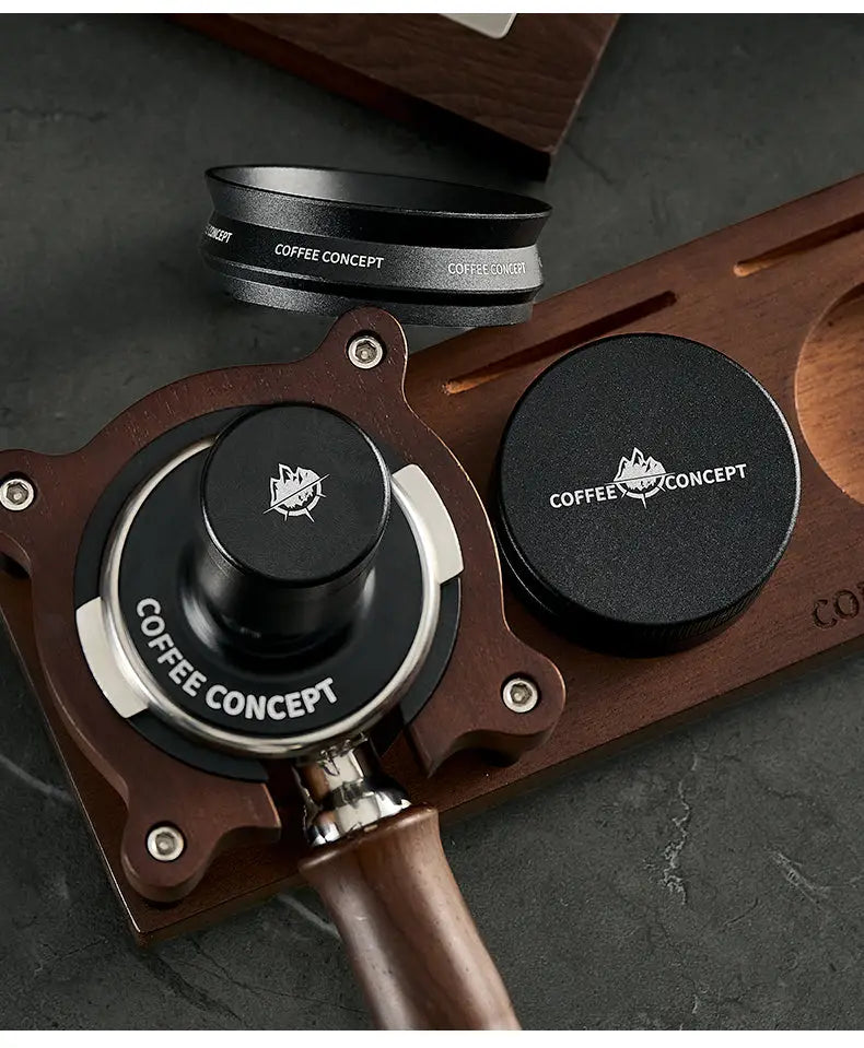 Black tamper and WDT tool set on wood stand with Coffee Concept logos