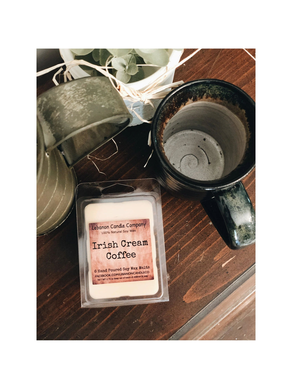 Soy wax melt clamshell labeled 'Irish Cream Coffee' with a wax warmer nearby