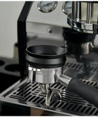 Black magnetic anti-static dosing ring fitted on a metal espresso portafilter