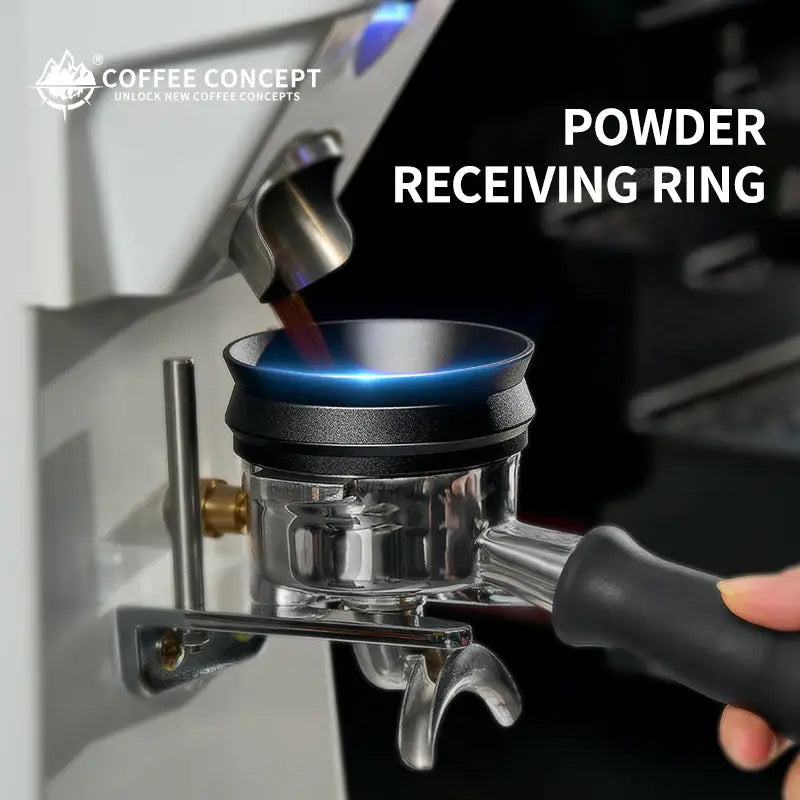 Black magnetic espresso dosing ring attached to a stainless coffee funnel, with handle grip visible.