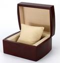 Square dark-brown gift box with open lid and beige cushion insert