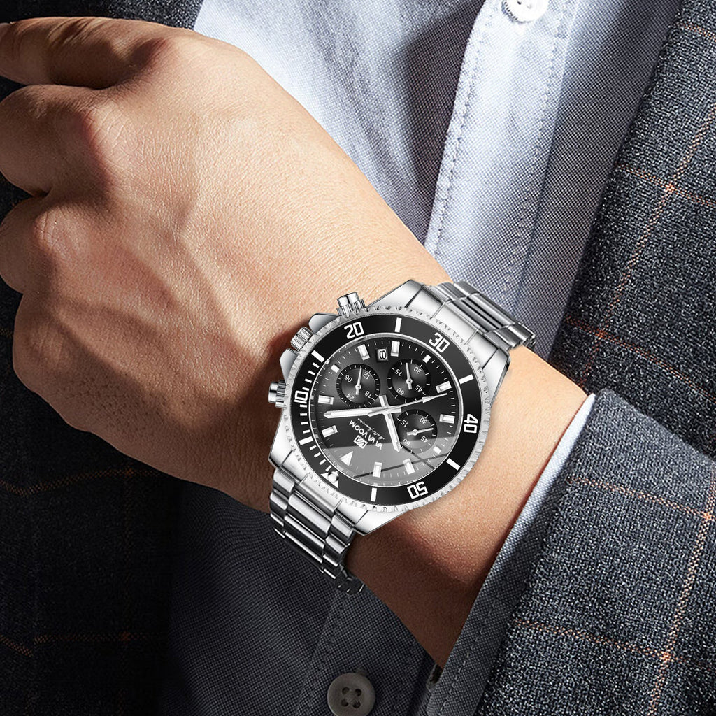 Men's silver wristwatch on wrist with black dial and multi-dial chronograph design