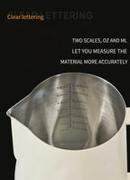 Stainless milk pitcher showing interior measurement markings and curved rim