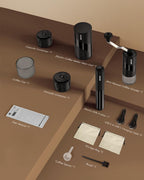 All-in-1 portable espresso set with grinder, frother, cup containers, and charging cable