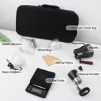 Portable pour-over coffee kit laid out with travel bag, kettle, manual grinder, dripper, scale and mug
