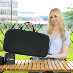 Person carrying black travel case holding portable pour-over coffee maker kit