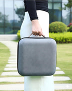 Gray travel coffee kit case with carry handle held by person outdoors