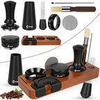 Black espresso accessory set laid out: tamper, tools, puck screen, dosing funnel, brush