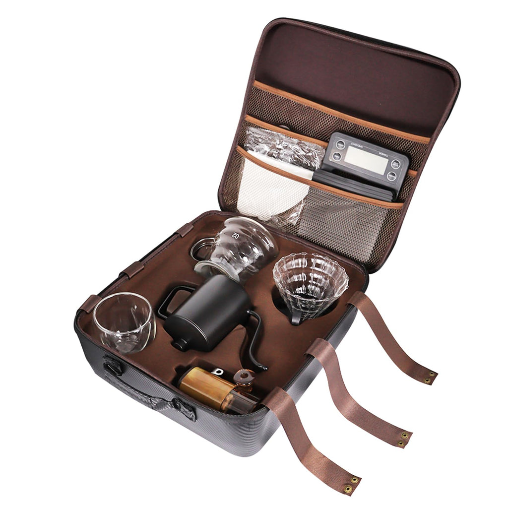 Opened coffee kit travel bag with glass server, kettle, dripper, filters, and grinder parts