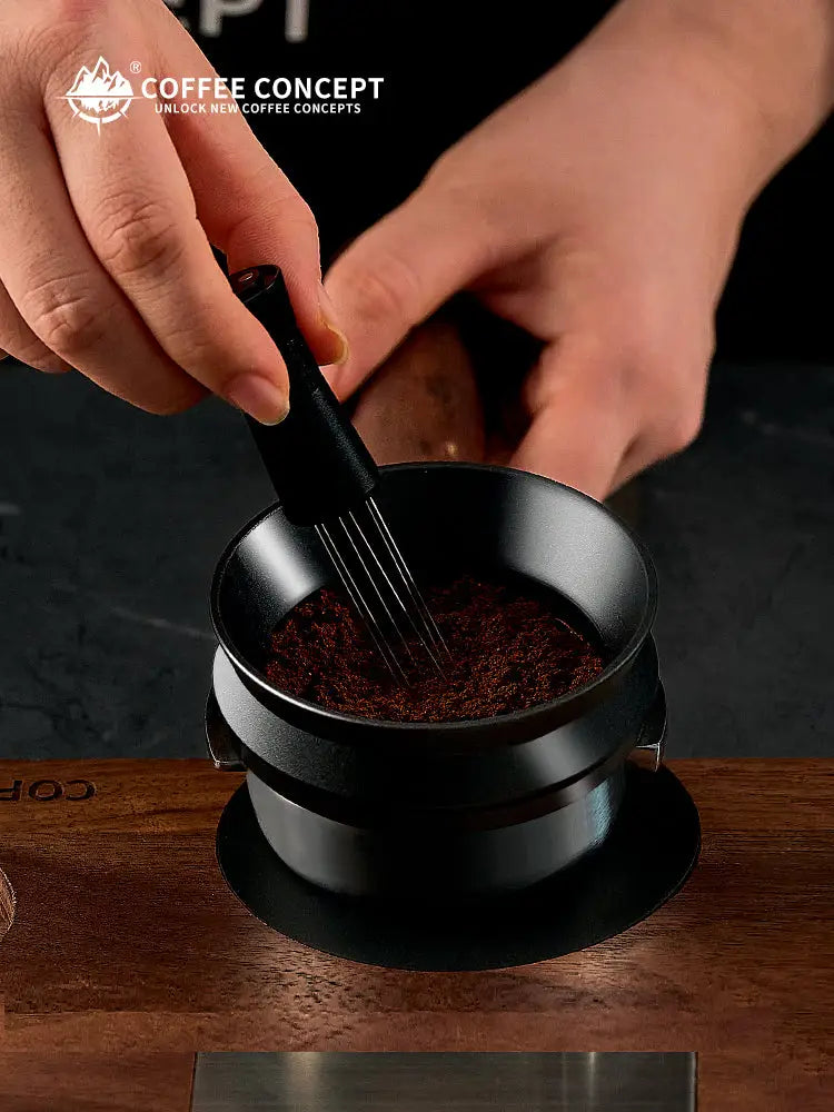 Black magnetic espresso dosing ring placed on an espresso portafilter basket