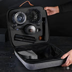 Open black travel case showing grinder, kettle, dripper, carafe, and tools