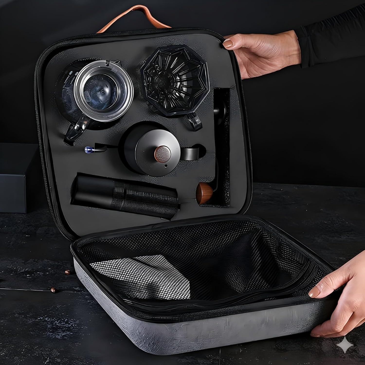 Open black travel case showing grinder, kettle, dripper, carafe, and tools