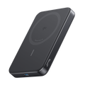 Slim wireless power bank, black with magnetic charging disc on top.
