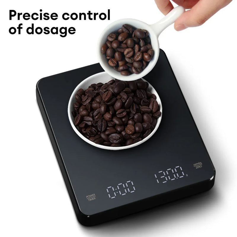 Black digital kitchen scale with LED display and weighing surface