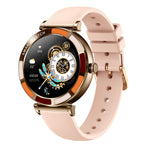 Gold smartwatch with pink silicone band, round black display with colorful UI and clock