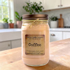 Coffee-scented soy candle in clear glass jar with twine tied around lid