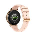 Gold smartwatch with light pink silicone band, round black face with green glow graphic