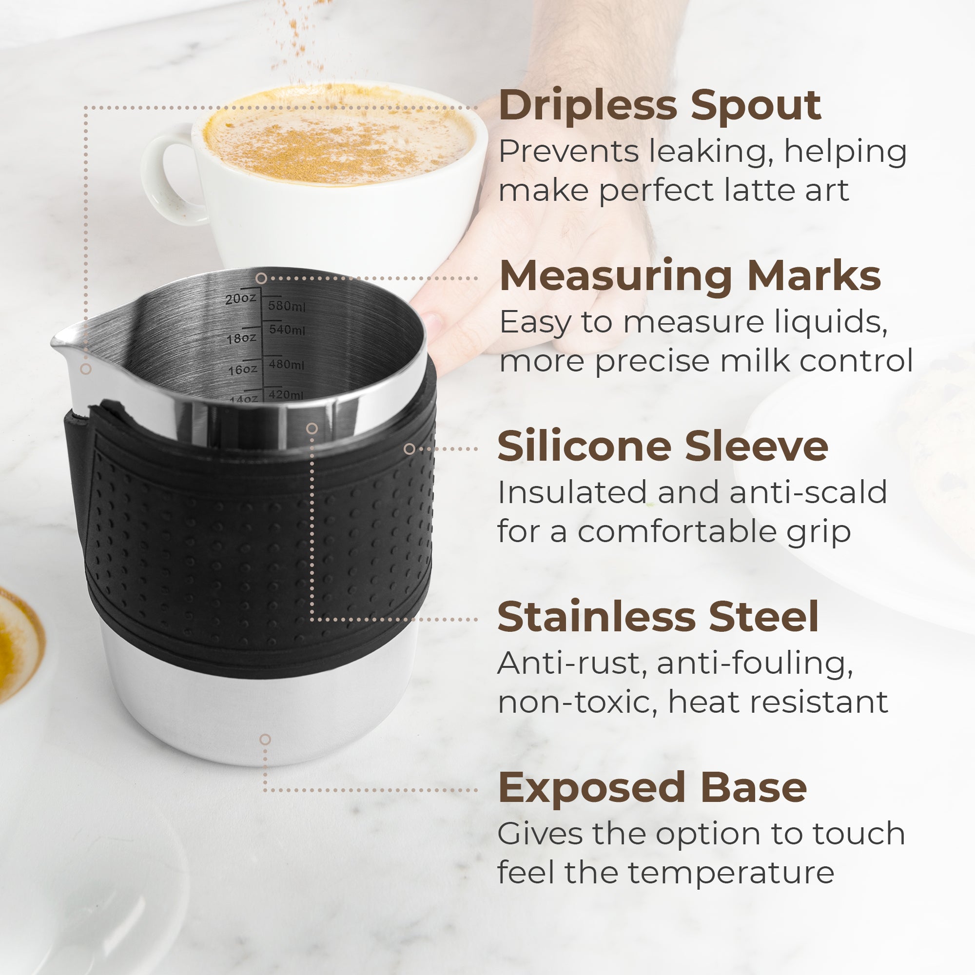 Stainless espresso milk frothing pitcher with black silicone sleeve and marked interior