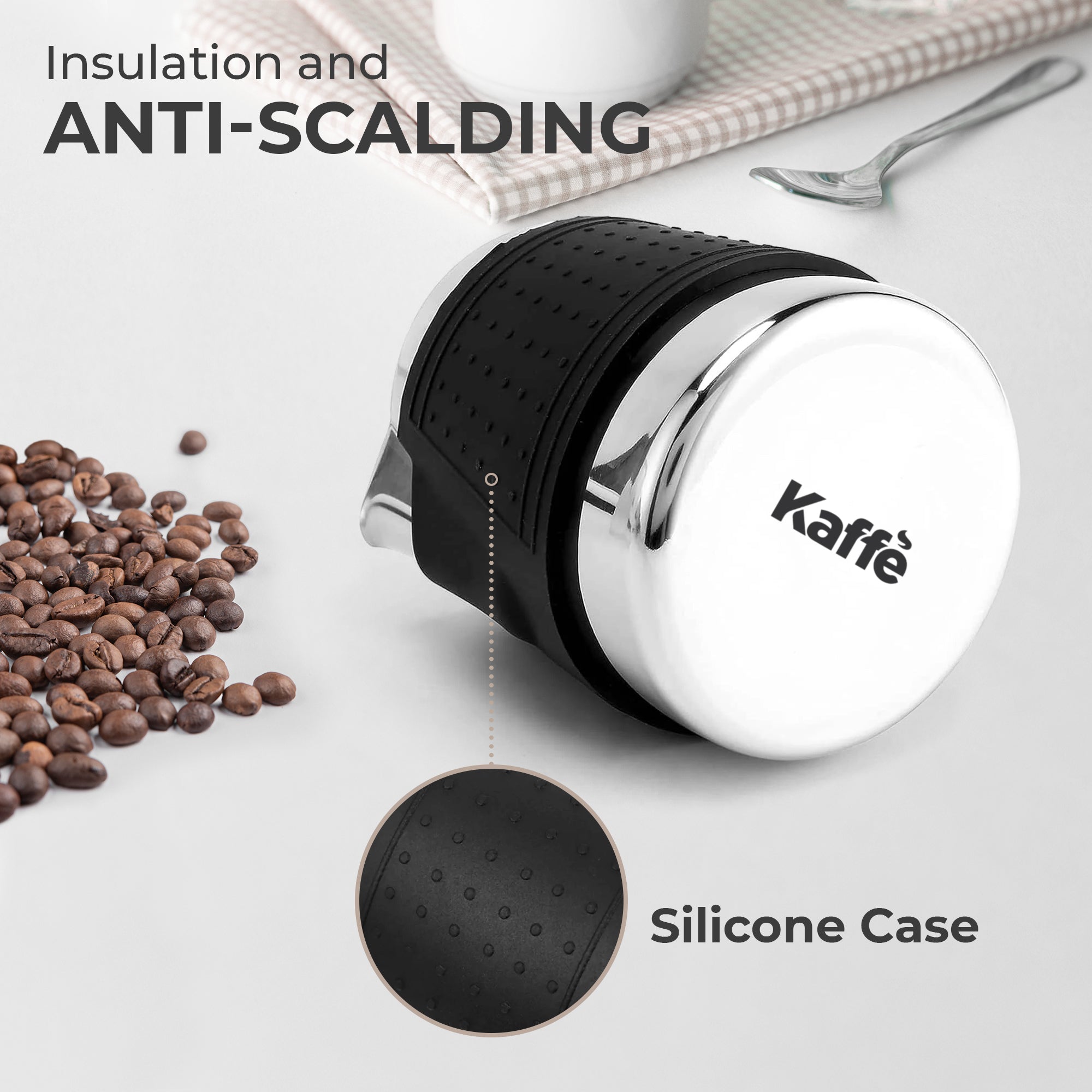 Stainless milk frothing pitcher with black anti-slip silicone sleeve and polished base