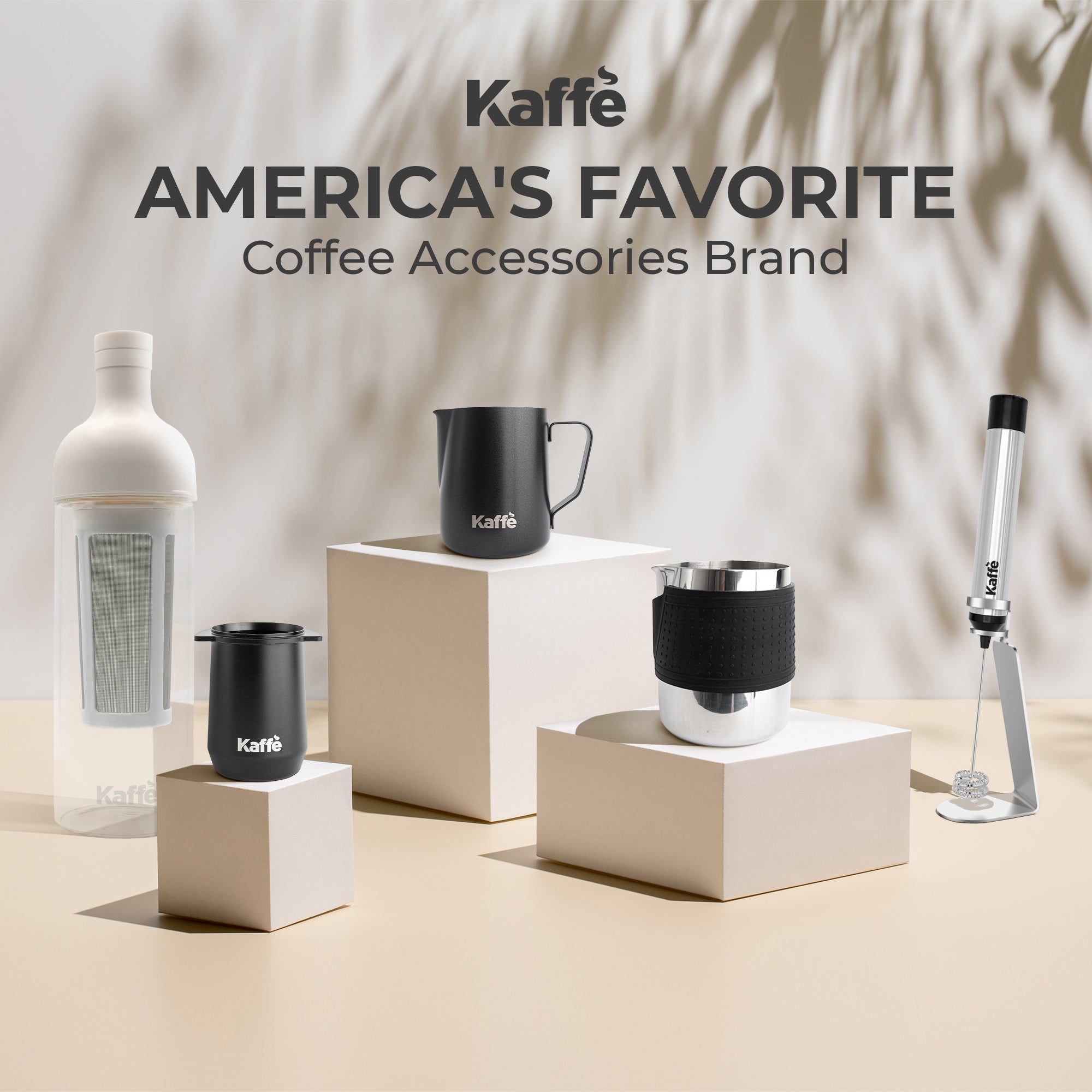 Black silicone-wrapped stainless milk frothing pitcher for espresso and latte art