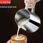 Stainless steel milk frothing pitcher pouring latte art, with internal measurement scale