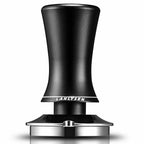 Spring-loaded espresso tamper with black handle and stainless base
