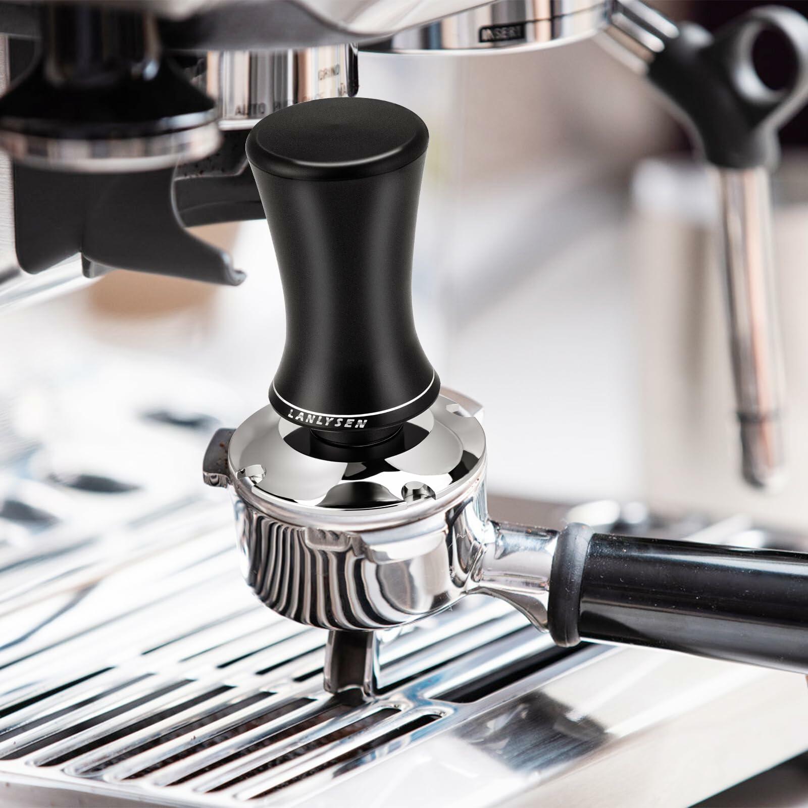 Spring-loaded espresso tamper mounted on an espresso machine portafilter